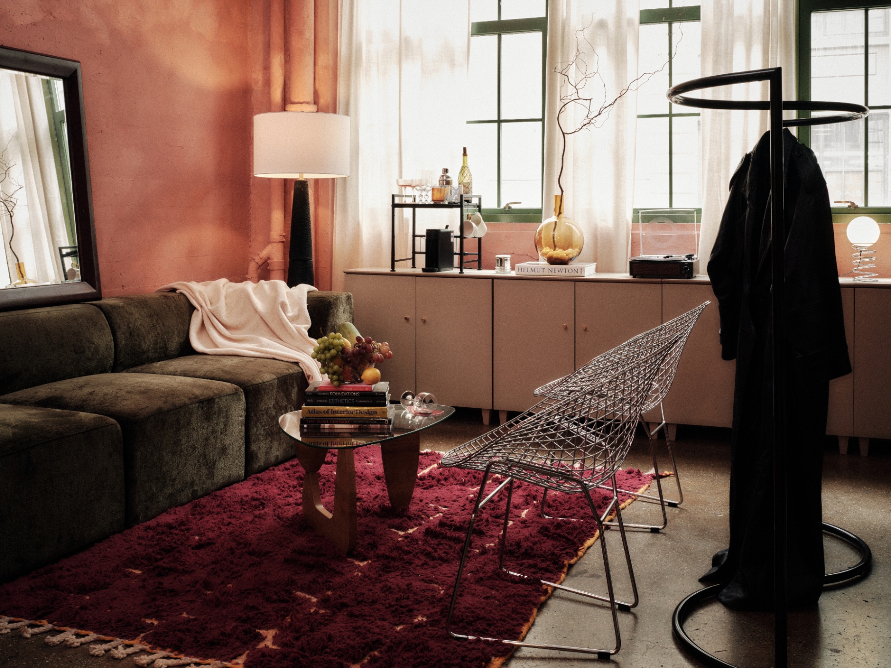 Studio lounge with green sofa and warm light